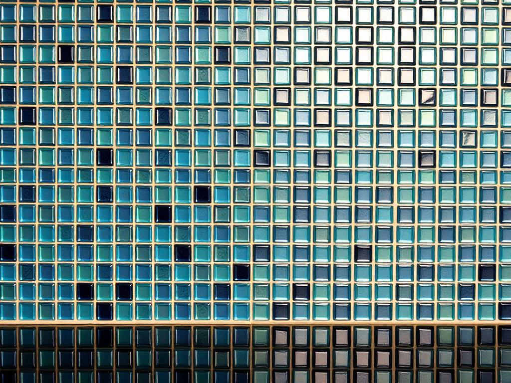 Glass tile mosaic backsplash in a kitchen